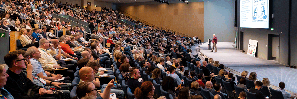 Speak on the EuroSTAR stage - a packed auditorium in a keynote talk at EuroSTAR 2022